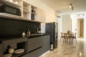 Fridge, microwave, stovetop, coffee/tea maker