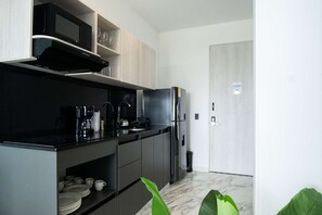 Fridge, microwave, stovetop, coffee/tea maker