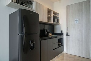 Fridge, microwave, stovetop, coffee/tea maker