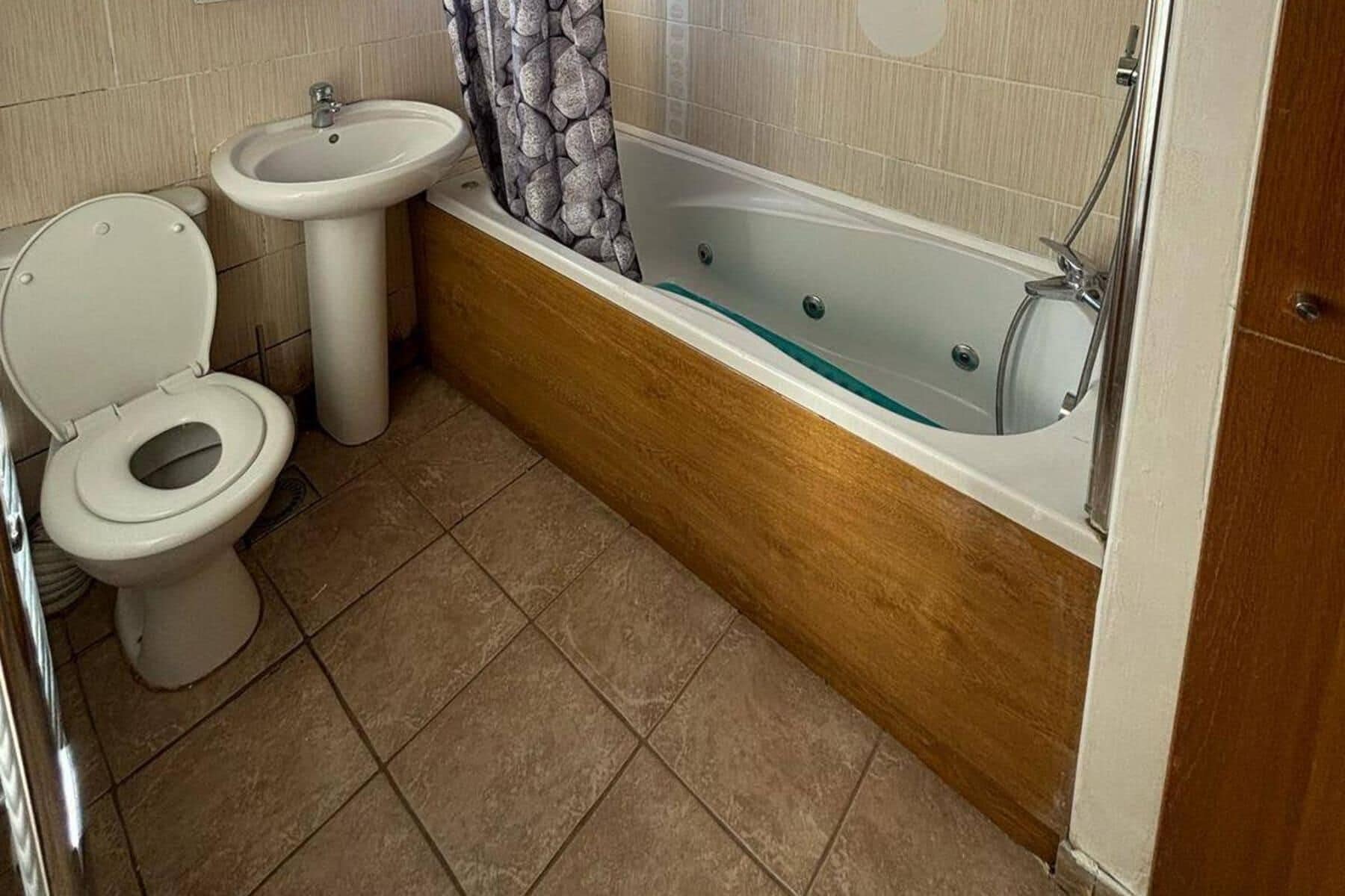 Combined shower/bathtub, deep-soaking bathtub, towels