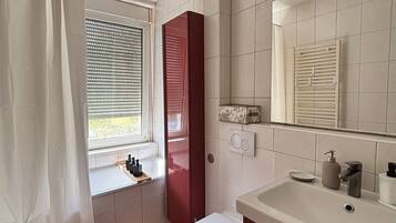 Hair dryer, towels, soap, toilet paper