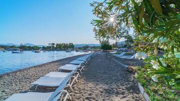 On the beach, sun loungers, beach umbrellas, beach towels