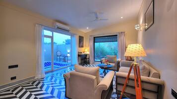 Premium Suite Cottage with Private Garden and Pool | Living area | 42-inch LED TV with digital channels