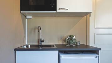 Fridge, microwave, cookware/dishes/utensils