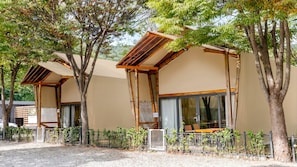 A row of modern, single-story buildings with large windows and wooden beams. - Gapyeong High Mong Glamping & Camping (Gapyeong)