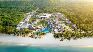 An aerial view of a resort with multiple buildings, a swimming pool, and a beach. - South Palms Resort And Spa Panglao - Mgallery Collection (Panglao)