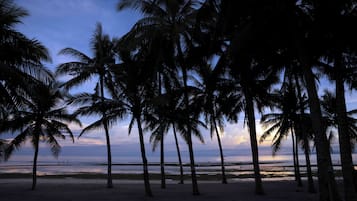 On the beach, white sand, free beach cabanas, sun loungers