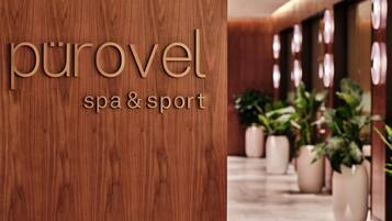 Puinen seinä, jossa on teksti ”purovel spa & sport”, mikä viittaa kylpylä- ja urheilukeskukseen.