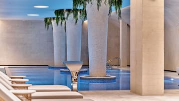 Indoor pool, open 9:00 AM to 9:00 PM, pool loungers