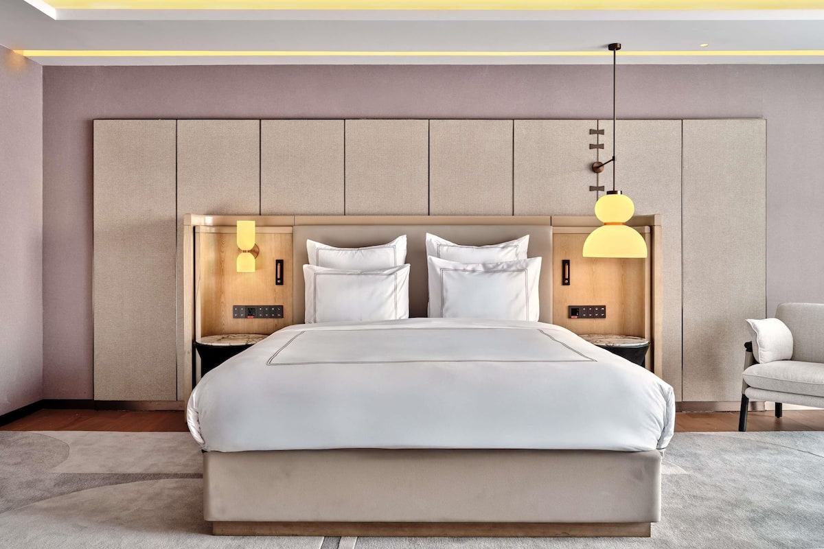 Premium bedding, down duvets, memory-foam beds, in-room safe