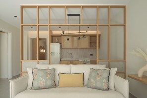Suite with Private Pool | Living area | 43-inch Smart TV with satellite channels - Paligremnos Infinity (Agios Vasileios)