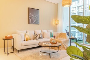 Luxury Apartment, Balcony, Lake View | Living area - Manzil-1BR Beach & Lagoon Access (Dubai)
