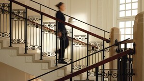 A staircase with ornate black railings and a light fixture above. - Mandarin Oriental, Vienna (Vienna)