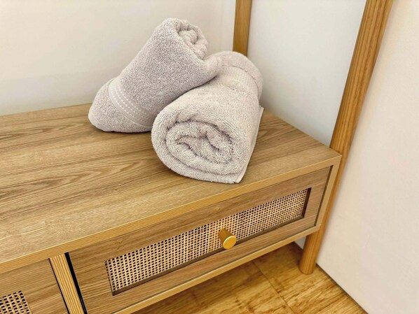 A wooden bedside table with a drawer and a small, perforated panel. - Luxurious Guest House in Yorkshire With Parking (Selby)