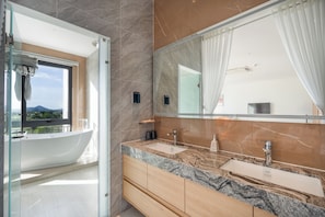 Executive Double Room, Beach View | Bathroom | Hair dryer, slippers, towels, soap