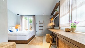 A modern bedroom with a bed, bedside table, and a view of the outdoors. - Moya Boutique Sleep (Drvenik Mali)