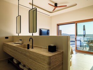 Premium Suite with Panoramic View & Shared Heated Pool | Bathroom | Shower, hair dryer, slippers, towels - Petrablu Mykonos (Mykonos)