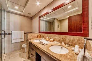 Apartment, Balcony, City View | Bathroom | Slippers, towels, soap, shampoo