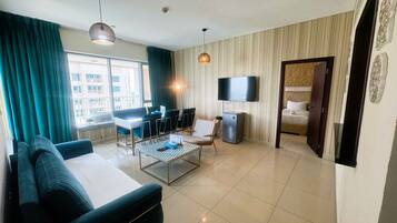 Apartment, Balcony, City View | Living area | Flat-screen TV