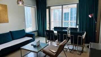 Apartment, Balcony, City View | Living area | Flat-screen TV