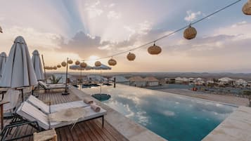 2 outdoor pools, pool umbrellas, pool loungers