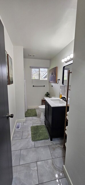 Shower, hair dryer, towels, soap