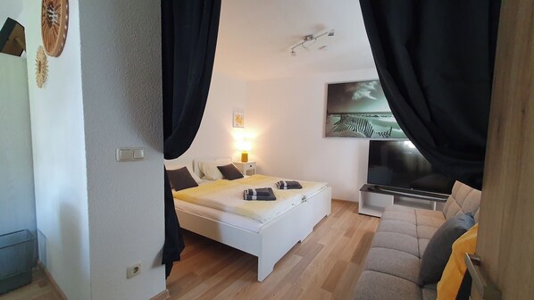 2 dormitorios, tabla de planchar con plancha, wifi gratis y ropa de cama