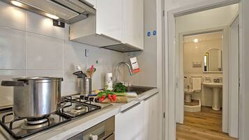 Family Apartment, Multiple Bedrooms (Garden & Surf Residenza By Max) | Private kitchen | Fridge, oven, stovetop, dishwasher