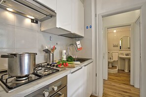 Family Apartment, Multiple Bedrooms (Garden & Surf Residenza By Max) | Private kitchen | Fridge, oven, stovetop, dishwasher - Garden & Surf Residenza By Max (Riva del Garda)