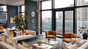 A modern living room with a large window, a sofa set, and a coffee table. - One Bedroom Apartment City View (London)