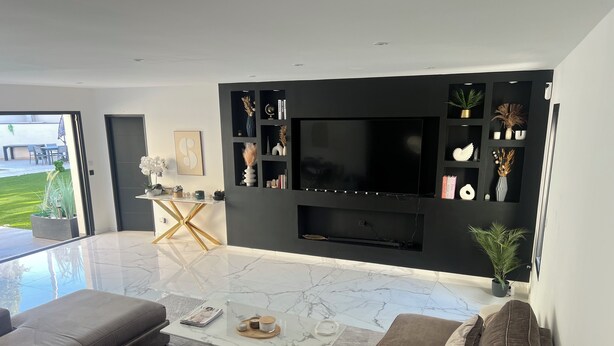 A modern living room with a large flat-screen TV, a marble coffee table, and a beige sofa. - Contemporary home in Vaison-la-Romaine  Comfort, light & heated pool in Provence (Vaison-la-Romaine)