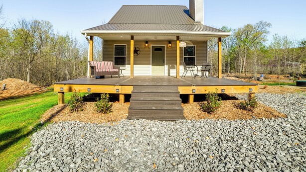 A single-story house with a covered porch, a chimney, and a front door. - 4 Mi to Lake Barkley: Pet-friendly Home w/ Hot Tub (Cadiz)