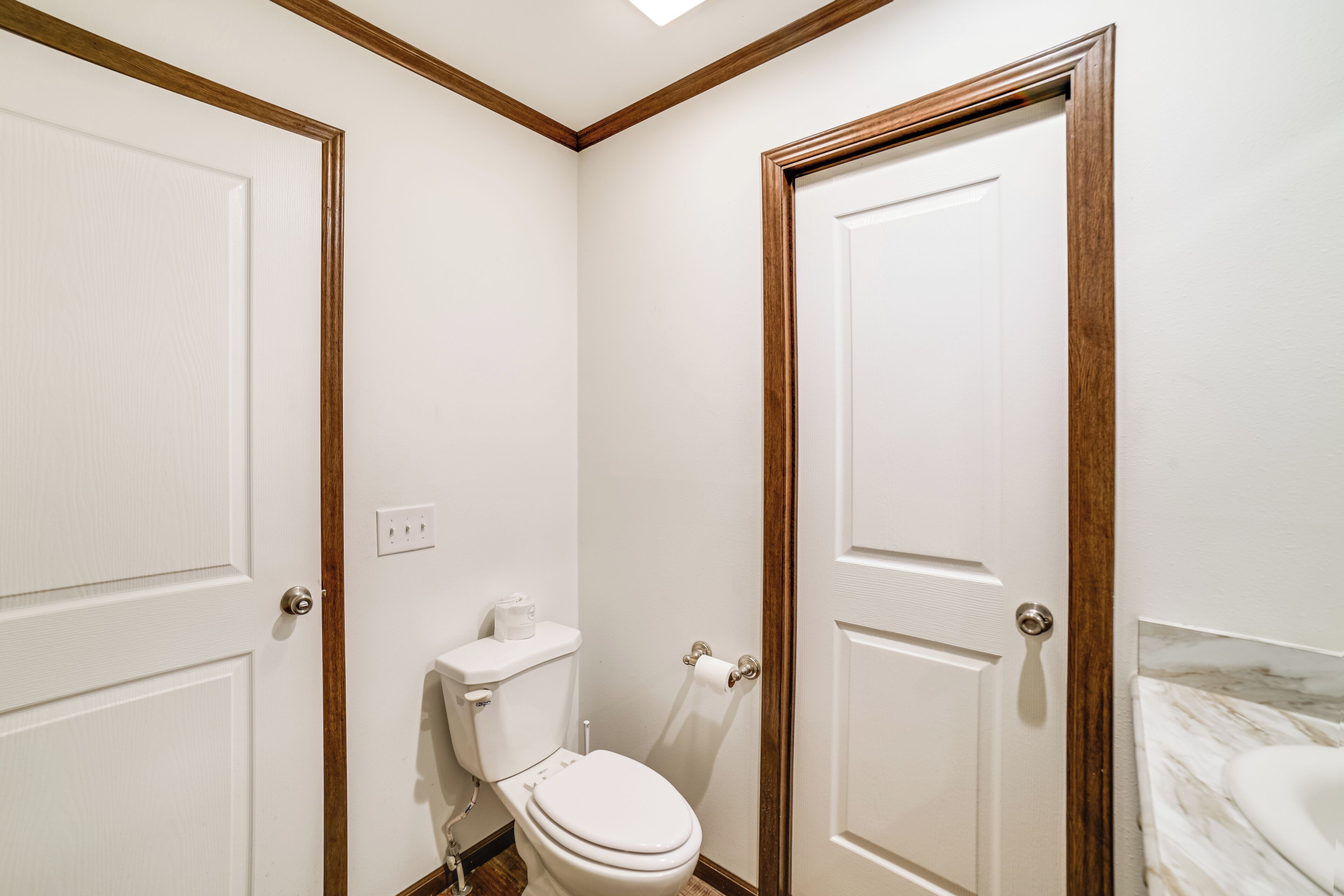 A bathroom with a toilet, a sink, and a shower.