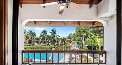 Stylish 2-Bedroom Beach Condo with Ocean-View Deck, Lush Pool Area & 2-Minute Walk to Flamingo Beach