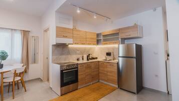 Apartment, Balcony | Private kitchen | Fridge, stovetop, cookware/dishes/utensils