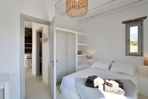 1 bedroom, desk, iron/ironing board, travel crib