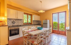 Fridge, stovetop, dishwasher, coffee/tea maker