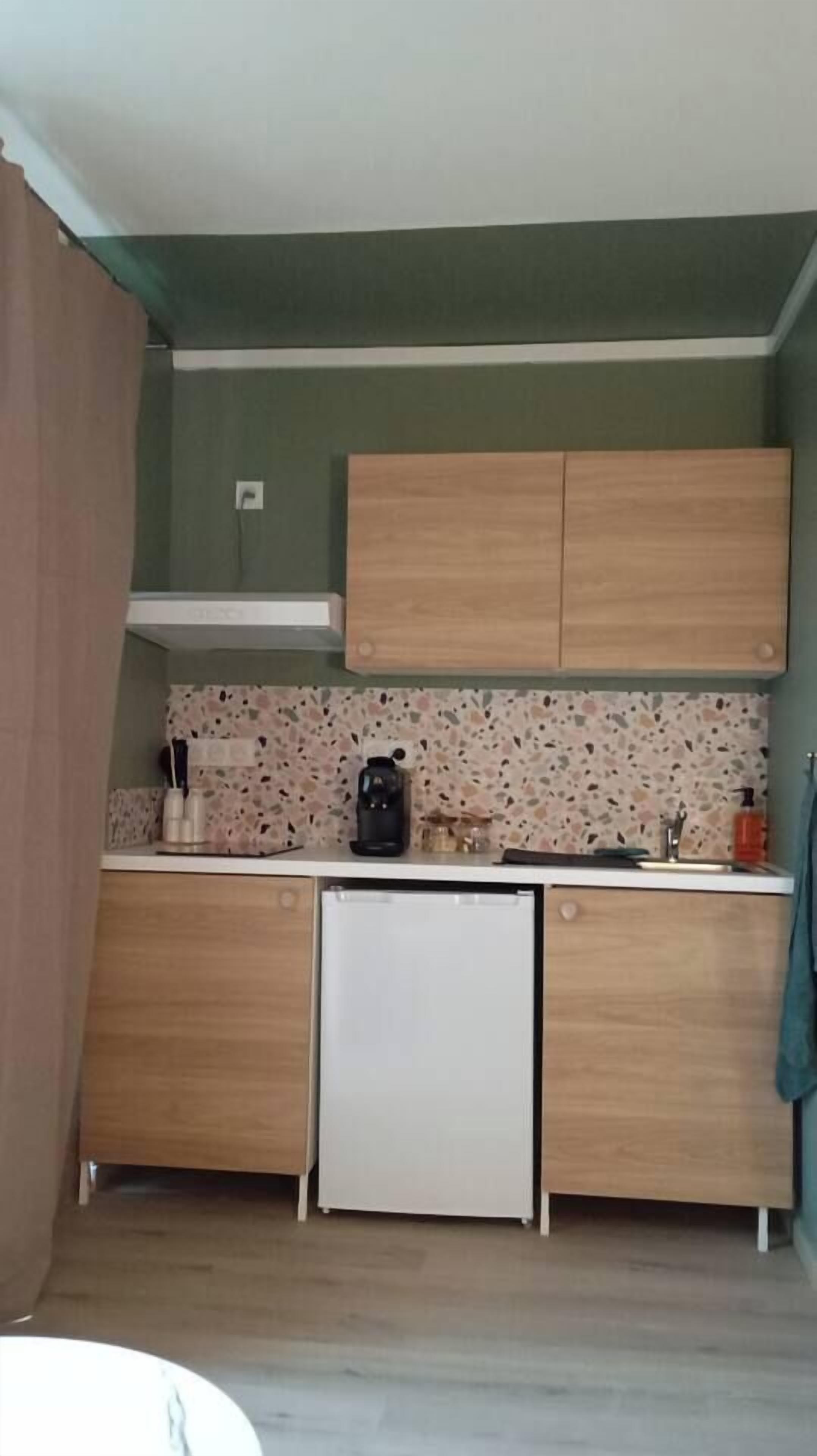 Fridge, microwave, coffee/tea maker, cookware/dishes/utensils