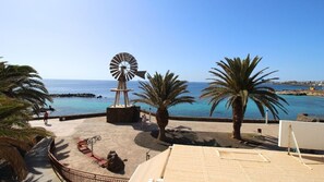 Deluxe Double Room, Beach View | In-room safe, laptop workspace, blackout drapes, iron/ironing board