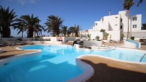 Outdoor pool, pool umbrellas, sun loungers