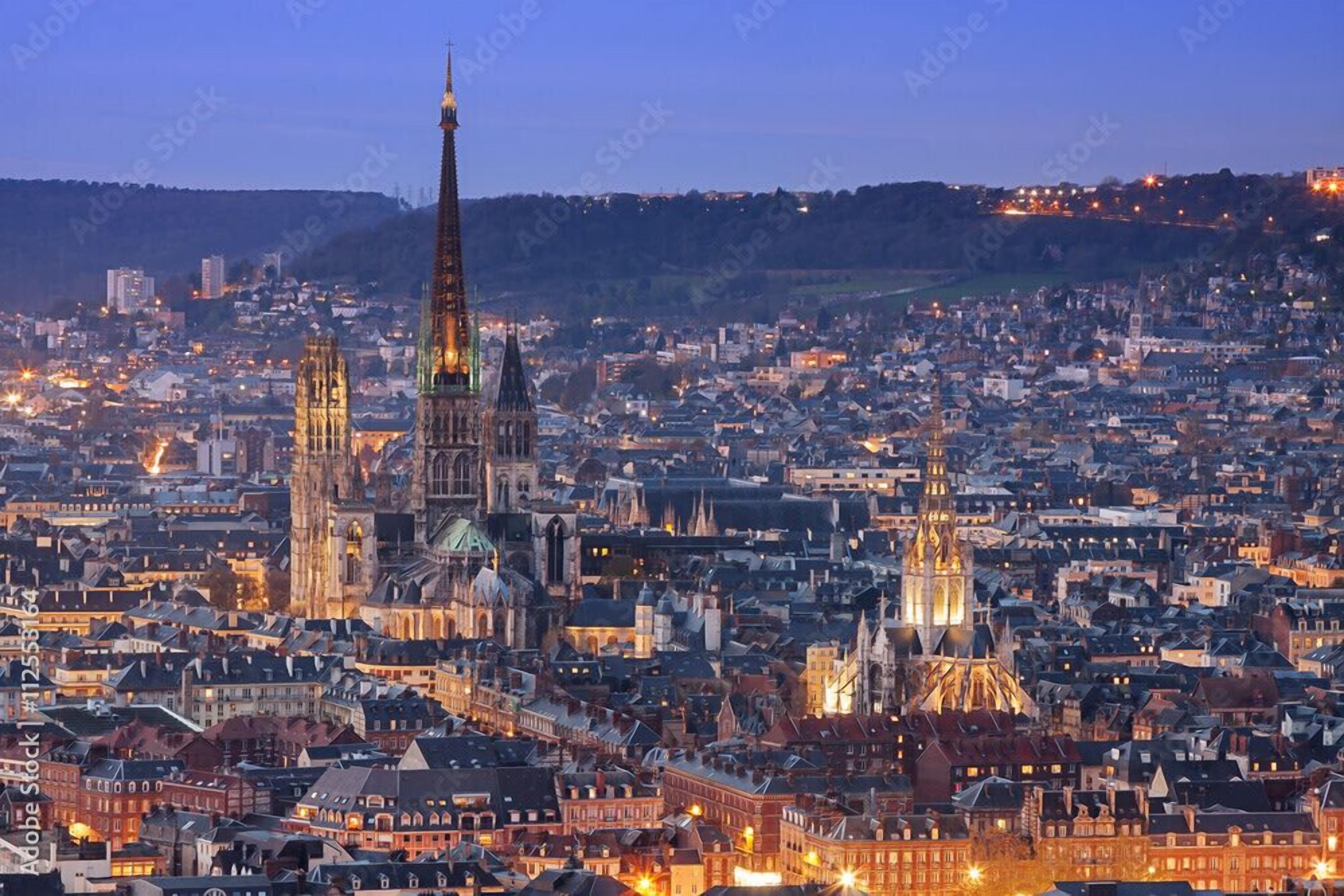 A cityscape with prominent Gothic-style spires and a densely packed urban area.
