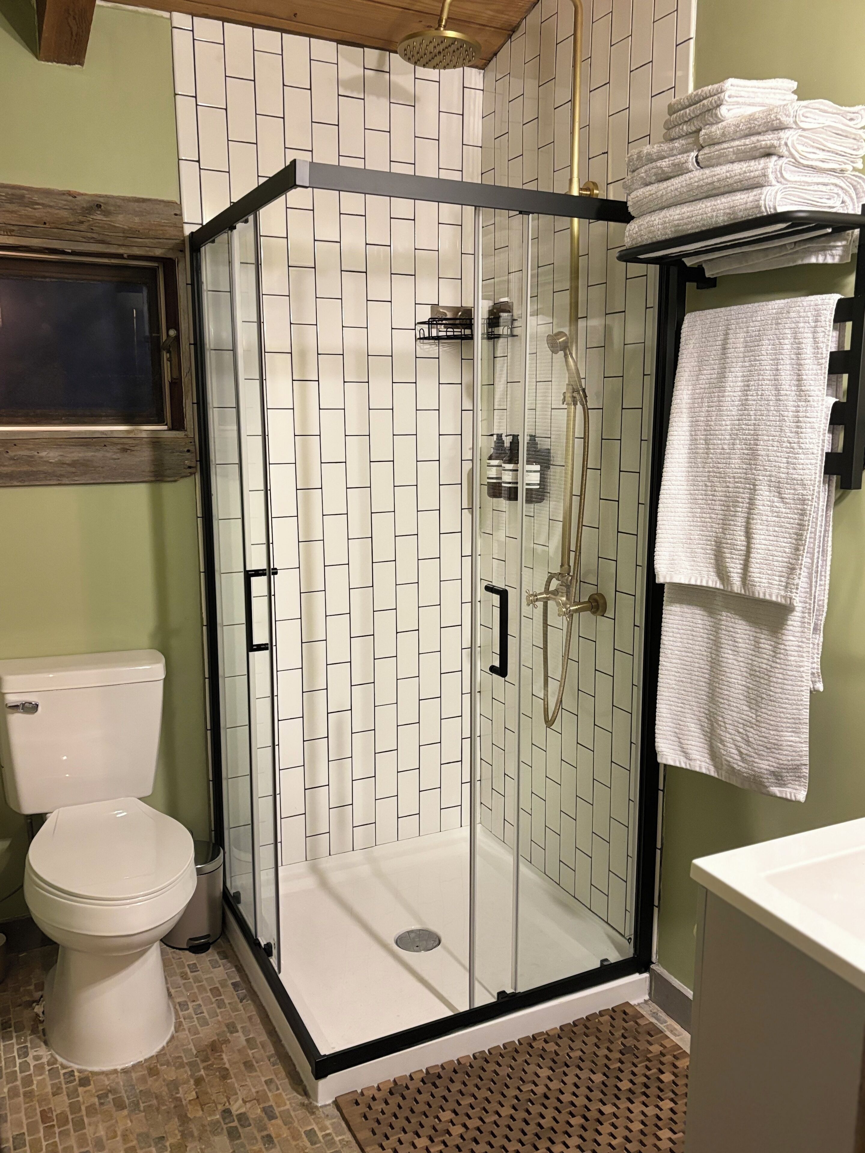 Shower, towels, soap, toilet paper