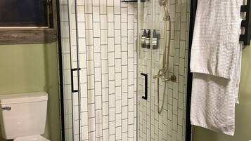 Shower, towels, soap, toilet paper