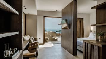 Suite junior, vista al mar | Área de sala de estar