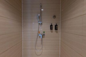 A shower with a handheld showerhead, a wall-mounted control panel, and a soap dispenser. - Vienna Zhihao Hotel (Guangzhou East Station Tianhe Bus Station Subway Station Store) (Guangzhou)
