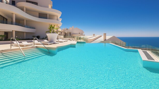 A swimming pool with a clear view of the ocean, surrounded by modern buildings with balconies. - Apartment Sleeps 4 With Gym & Spa (Benalmádena)
