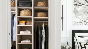 A walk-in closet with multiple shelves, hanging space, and drawers, featuring a variety of clothing and accessories. - Modern Apartment With Views Urban Sky 26ke (Málaga)