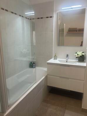 Shower, hair dryer, towels, soap