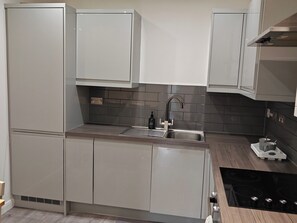Apartamento | Cozinha privada | Geladeira, fogão, cooktop, lava-louças