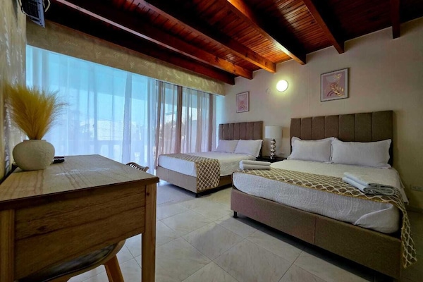 Quadruple Room, Pool View | In-room safe, free WiFi